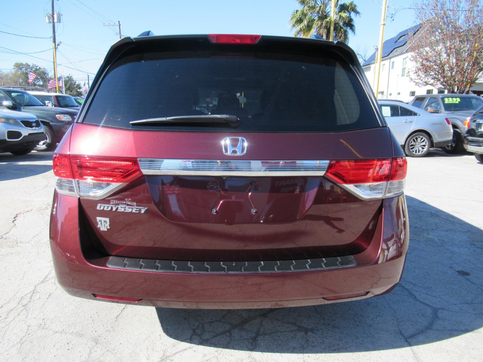 2016 Red /Tan Honda Odyssey EX-L (5FNRL5H62GB) with an 3.5L V6 SOHC 24V engine, Automatic transmission, located at 1511 North Shepherd Dr., Houston, TX, 77008, (281) 657-1221, 29.798361, -95.412560 - 2016 HONDA ODYSSEY EX-L VIN: 5FNRL5H62GB103369 5 F N R L 5 H 6 2 G B 1 0 3 3 6 9 VAN 3.5L V6 F SOHC 24V GASOLINE FRONT WHEEL DRIVE - Photo #38